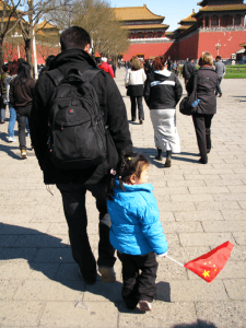 Father and daughter entering Forbidden City