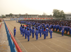 Students gather during flag-raising ceremony