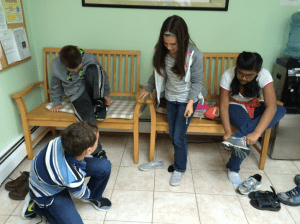 Taking shoes on and off at the Buddhist temple.